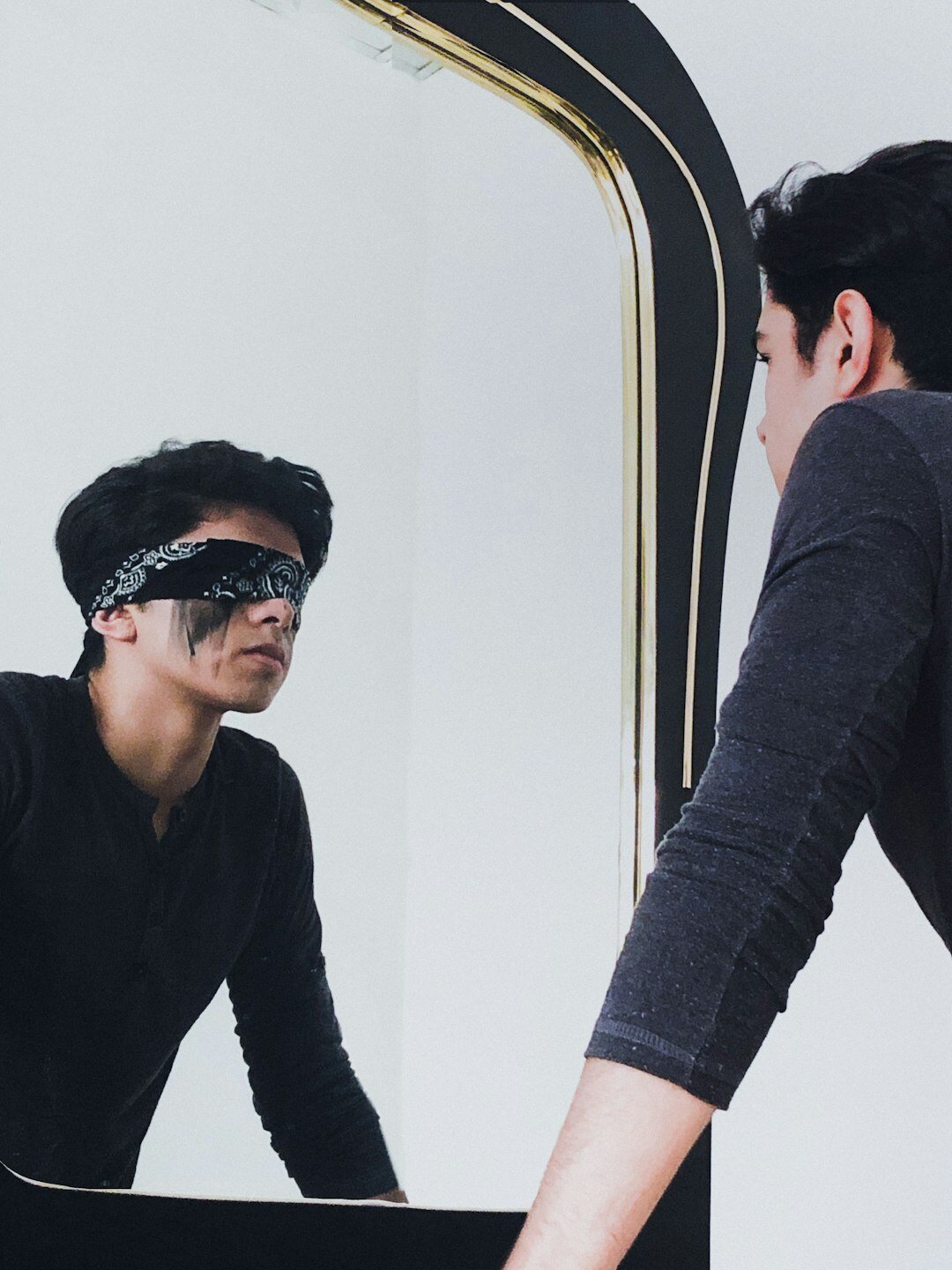 person reflecting in mirror